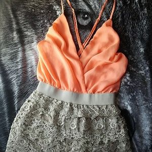 A beautiful coral & Champaign colored Romper.